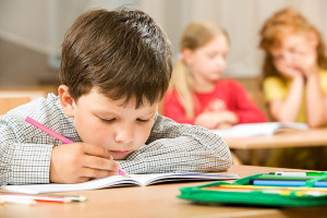 child doing puzzle